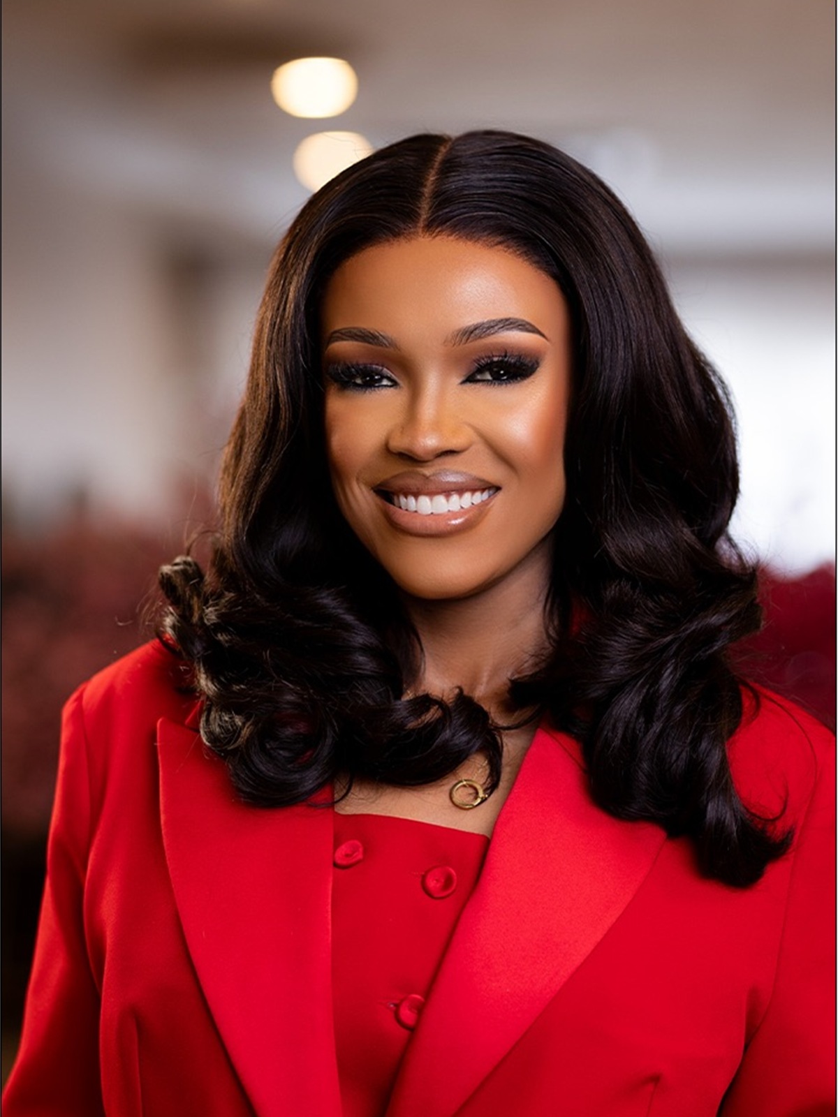 Captain Irene Ndanu in a red suit